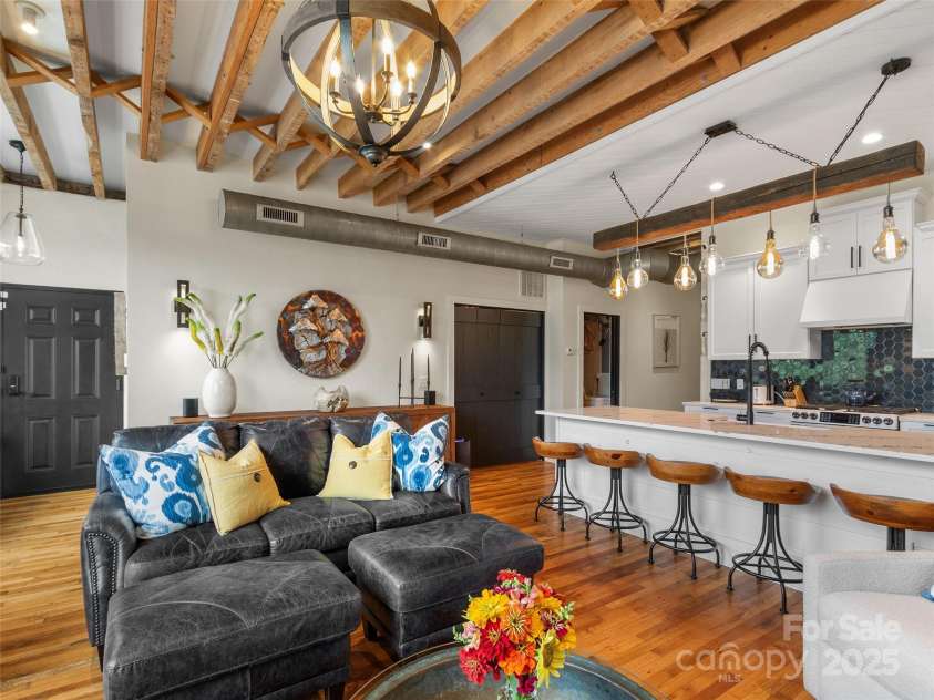 5 Town Square, Burnsville, NC 28714.  MLS# CAR4284216, YatesRealty ID 28535. Living Room with Kitchen Island Bar