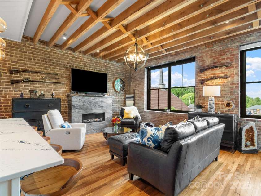 5 Town Square, Burnsville, NC 28714.  MLS# CAR4284216, YatesRealty ID 28535. Living Room with solid Quartzite Fireplace