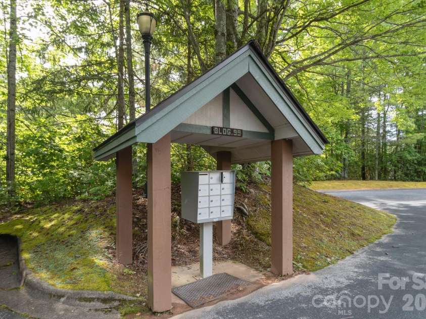 99 Ridgetop Circle, Brevard, NC 28712.  MLS# CAR4387560, YatesRealty ID 28540. Community Mail Center – Convenient covered mail center serving the building, thoughtfully positioned near parking and easy access points.