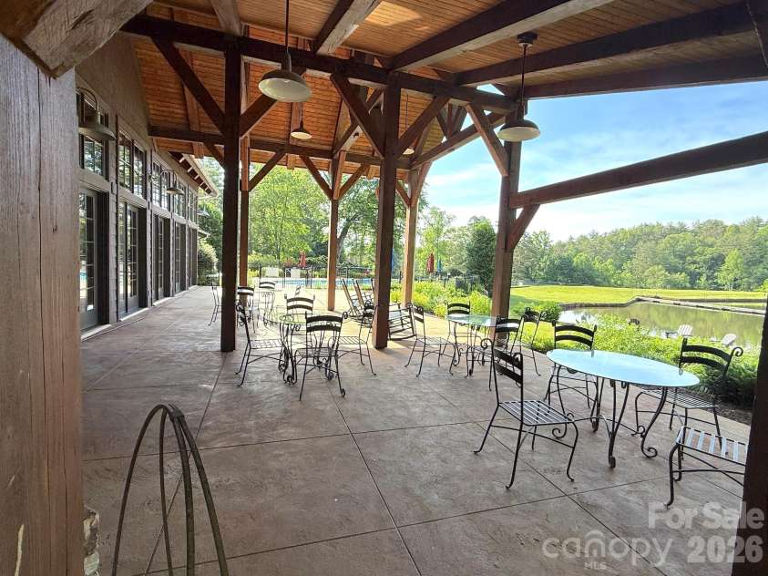 99 Ridgetop Circle, Brevard, NC 28712.  MLS# CAR4387560, YatesRealty ID 28540. Covered Lakeside Pavilion – Stunning covered lakeside pavilion with exposed timber framing, gathering areas, and peaceful water views—perfect for outdoor dining, relaxing, or socializing with neighbors.