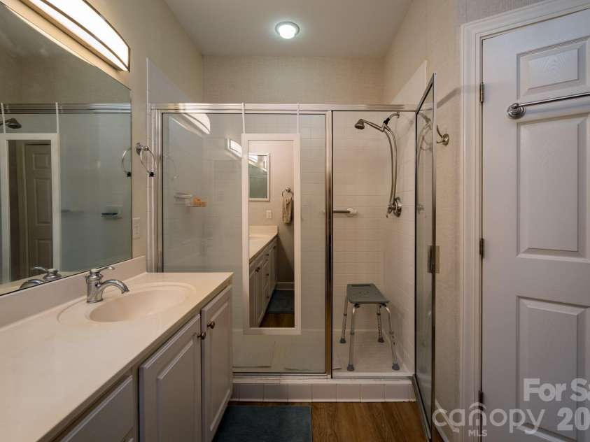 99 Ridgetop Circle, Brevard, NC 28712.  MLS# CAR4387560, YatesRealty ID 28540. Spacious Walk-In Shower Bath – Primary bathroom featuring an oversized walk-in shower, ample vanity space, and easy accessibility.