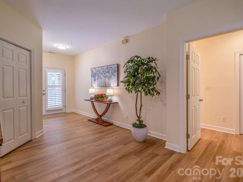 99 Ridgetop Circle, Brevard, NC 28712.  MLS# CAR4387560, YatesRealty ID 28540. Wide Foyer & Entry Hall – Expansive entry hall with updated flooring, neutral finishes, and welcoming transition into the home’s open living spaces.