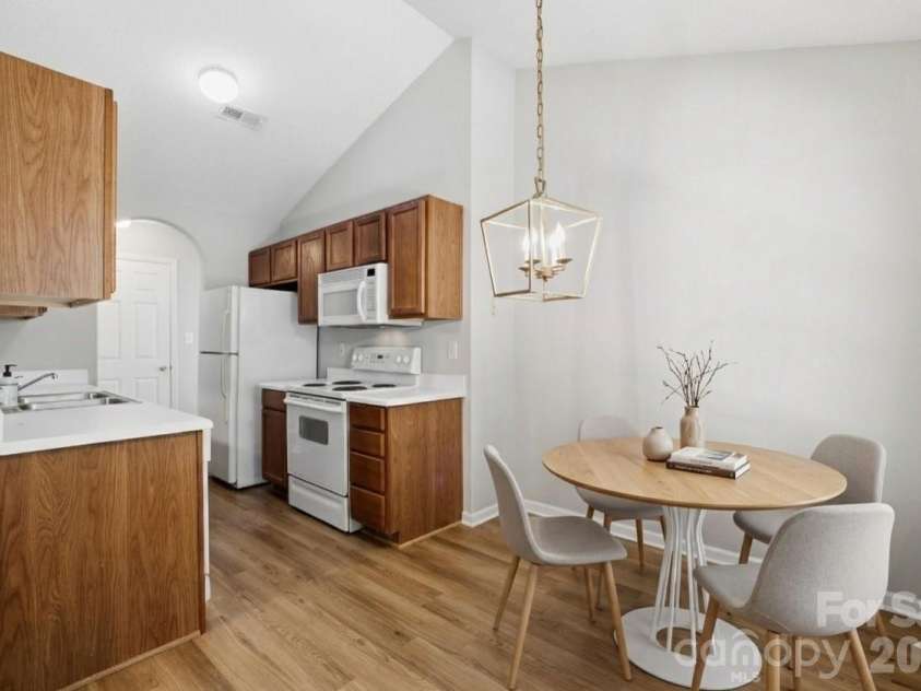 7616 Silver Arrow Drive, Charlotte, NC 28273.  MLS# CAR4383749, YatesRealty ID 28542. Kitchen open to DiningVirtual Staging