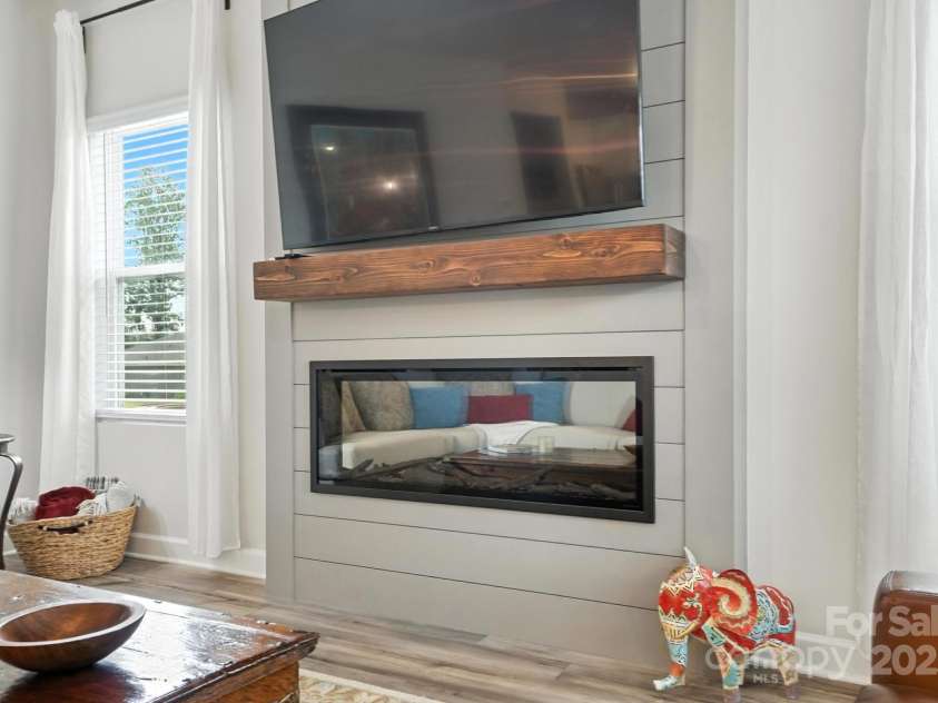 3140 Seville Street, Charlotte, NC 28214.  MLS# CAR4285079, YatesRealty ID 28543. Cozy evenings by the custom fireplace, the perfect spot to unwind