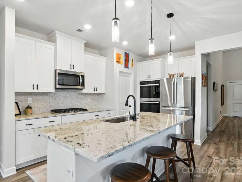 3140 Seville Street, Charlotte, NC 28214.  MLS# CAR4285079, YatesRealty ID 28543. Dream kitchen with stainless appliances and oversized island