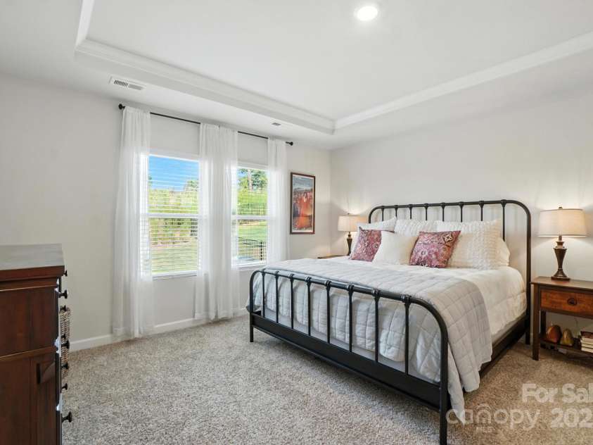 3140 Seville Street, Charlotte, NC 28214.  MLS# CAR4285079, YatesRealty ID 28543. Retreat to your serene first floor primary suite with tray ceiling and soft natural light