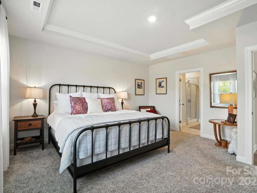 3140 Seville Street, Charlotte, NC 28214.  MLS# CAR4285079, YatesRealty ID 28543. Retreat to your serene first floor primary suite with tray ceiling and soft natural light
