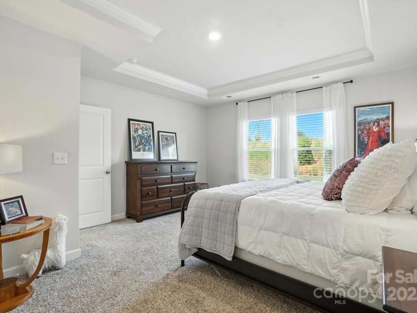 3140 Seville Street, Charlotte, NC 28214.  MLS# CAR4285079, YatesRealty ID 28543. Retreat to your serene first floor primary suite with tray ceiling and soft natural light