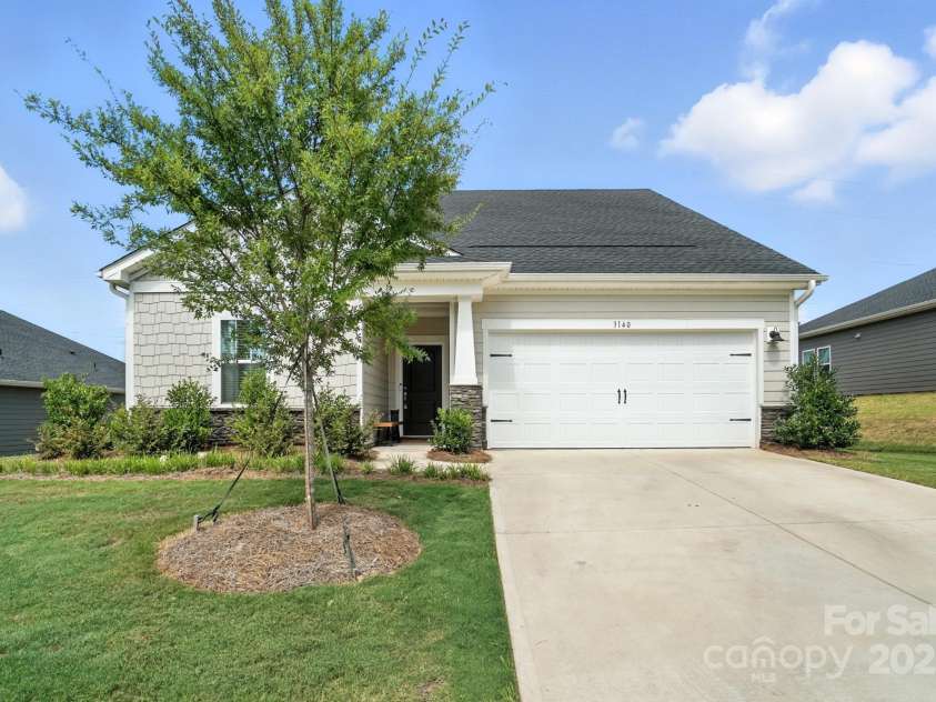 3140 Seville Street, Charlotte, NC 28214.  MLS# CAR4285079, YatesRealty ID 28543. Spacious driveway and 2-car garage for easy parking and storage