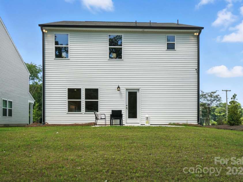 1103 Overland Drive, Dallas, NC 28034.  MLS# CAR4282641, YatesRealty ID 28548. Back of home and yard