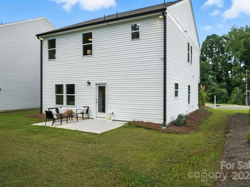 1103 Overland Drive, Dallas, NC 28034.  MLS# CAR4282641, YatesRealty ID 28548. Back of home and yard