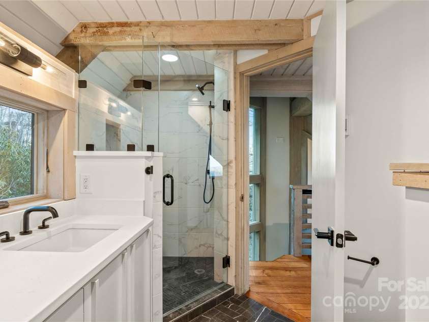 220 Worley Road, Highlands, NC 28741.  MLS# CAR4298610, YatesRealty ID 28552. Primary bath with heated marble floors