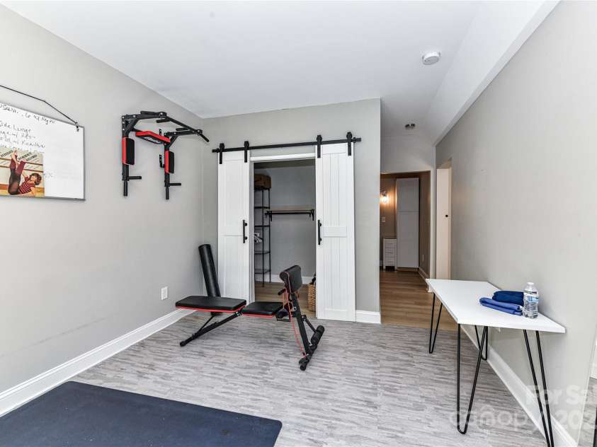 11730 Maher Lane, Huntersville, NC 28078.  MLS# CAR4281709, YatesRealty ID 28558. Bedroom 6 on Basement level with barn doors to closet!