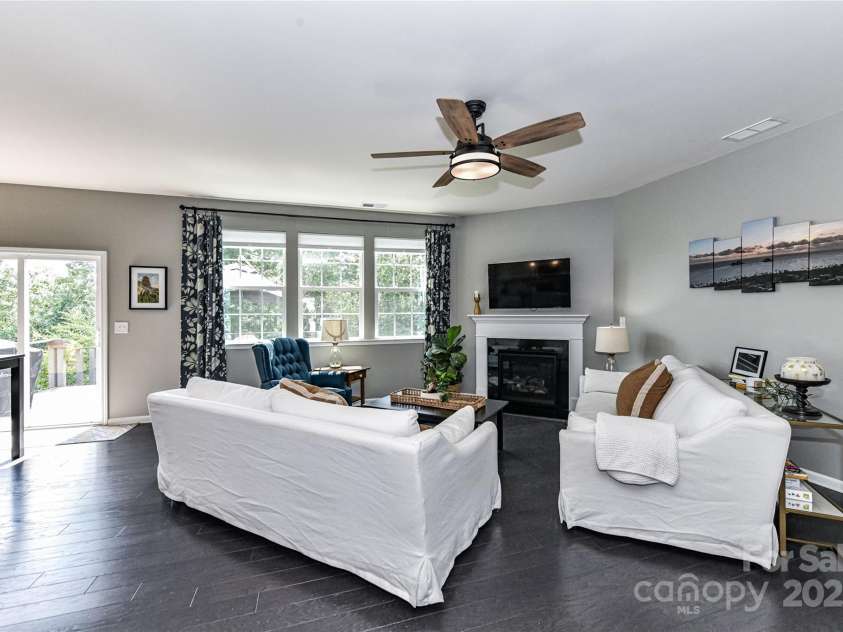 11730 Maher Lane, Huntersville, NC 28078.  MLS# CAR4281709, YatesRealty ID 28558. Great Room offers gas fireplace, ceiling fan/light & deck access!