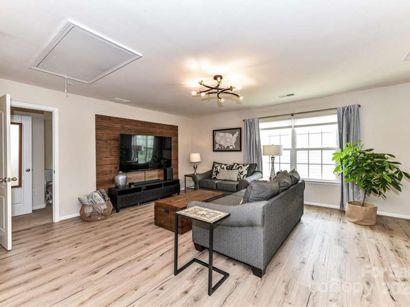 11730 Maher Lane, Huntersville, NC 28078.  MLS# CAR4281709, YatesRealty ID 28558. Large Loft Area perfect for extra seating/living area with LVP & attic storage!