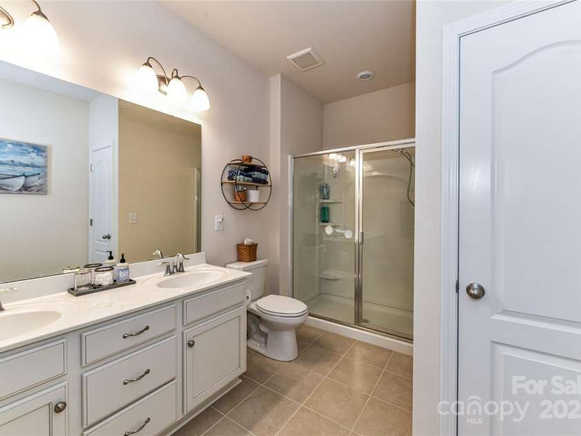11730 Maher Lane, Huntersville, NC 28078.  MLS# CAR4281709, YatesRealty ID 28558. Main level Guest Bath with dual vanity, full shower & tile floors!
