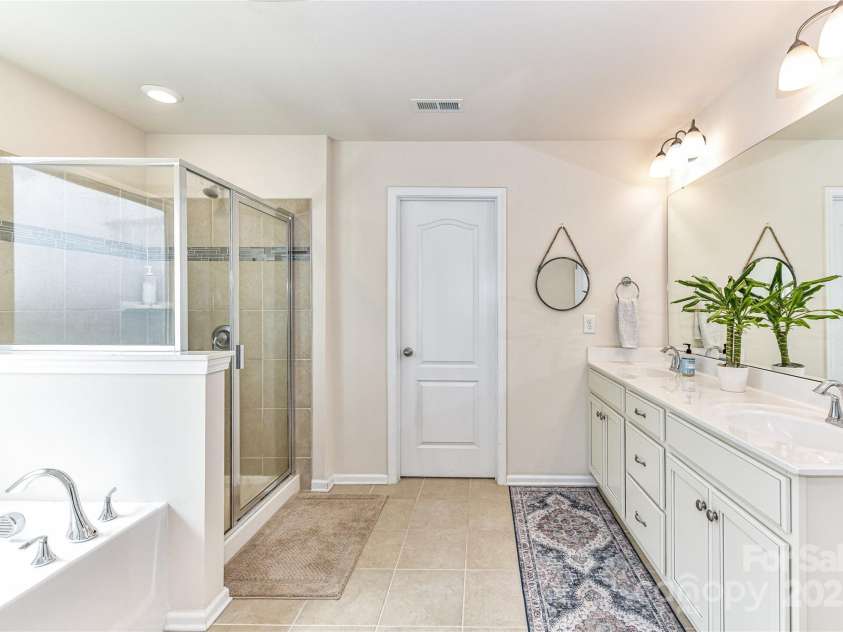 11730 Maher Lane, Huntersville, NC 28078.  MLS# CAR4281709, YatesRealty ID 28558. Primary Bath features dual vanity, garden tub, tile surround shower, water closet & tile floors!