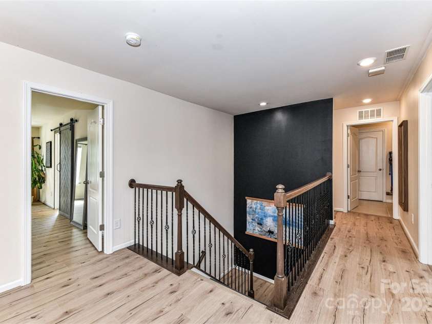 11730 Maher Lane, Huntersville, NC 28078.  MLS# CAR4281709, YatesRealty ID 28558. Staircase landing with LVP floors!