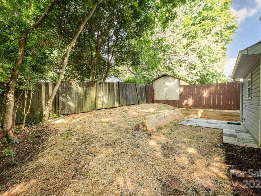248 Pangle Drive, Charlotte, NC 28217.  MLS# CAR4281610, YatesRealty ID 28559. Backyard side view