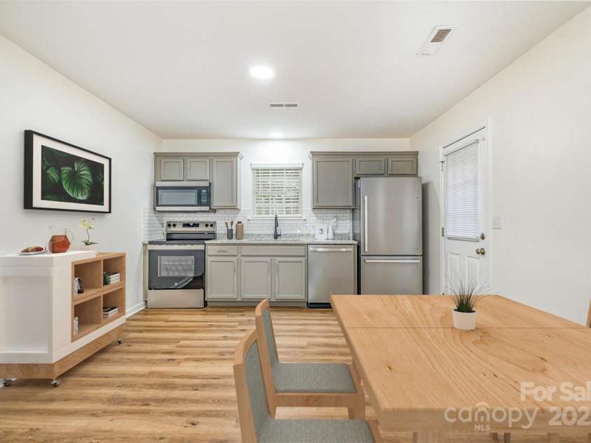 248 Pangle Drive, Charlotte, NC 28217.  MLS# CAR4281610, YatesRealty ID 28559. Kitchen / dining virtually staged