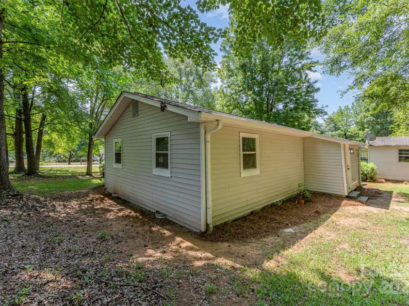 3724 Patricia Drive, Concord, NC 28027.  MLS# CAR4272555, YatesRealty ID 28565. Back of home (side view)