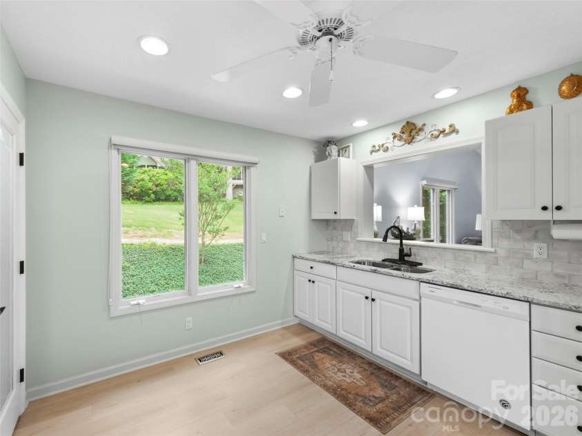 83 Laurel Ridge Place, Hendersonville, NC 28739.  MLS# CAR4389214, YatesRealty ID 28577. Kitchen with Sink looking into Dining Room