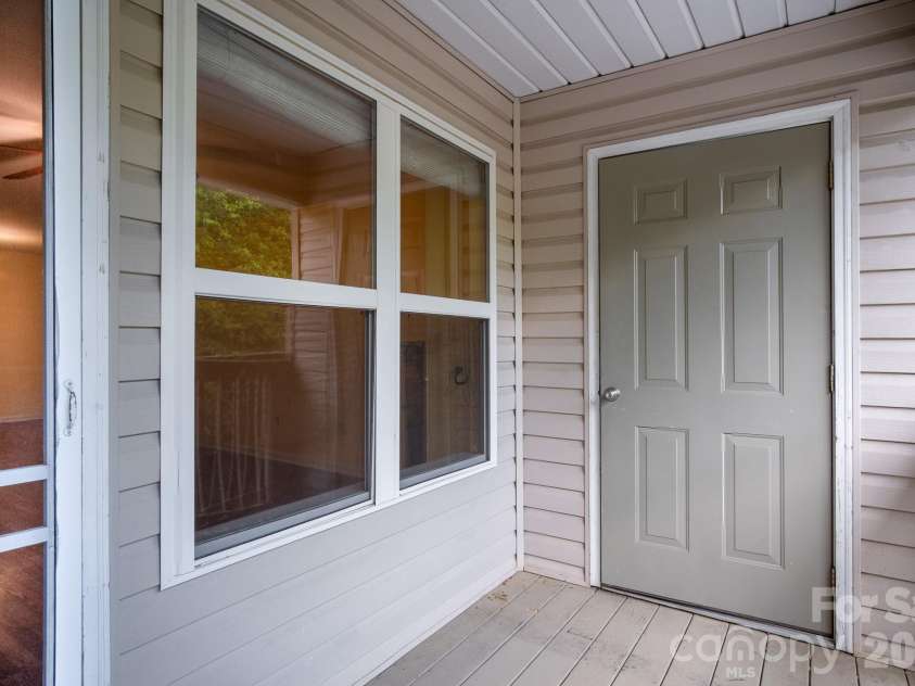 515 Carrington Place, Arden, NC 28704.  MLS# CAR4383772, YatesRealty ID 28586. Back deck area with storage closet.