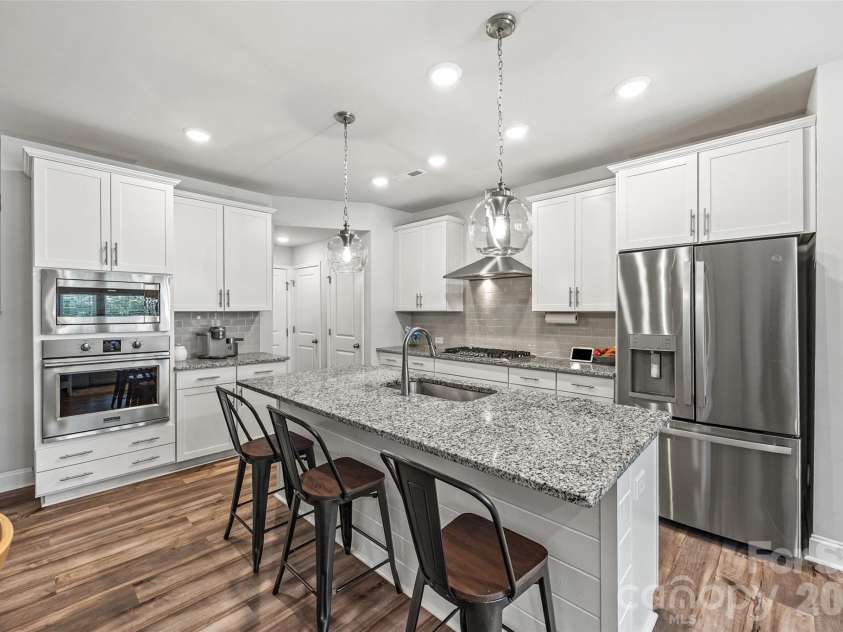 2511 Duncan Avenue, Charlotte, NC 28205.  MLS# CAR4383091, YatesRealty ID 28591. Additional seating at the kitchen island