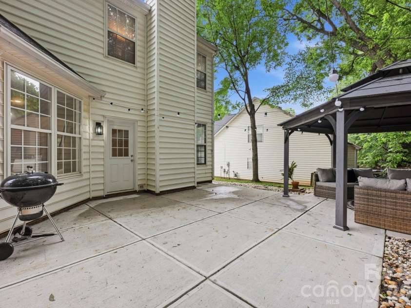 4902 Windchase Lane, Charlotte, NC 28269.  MLS# CAR4389569, YatesRealty ID 28592. Large Back Patio