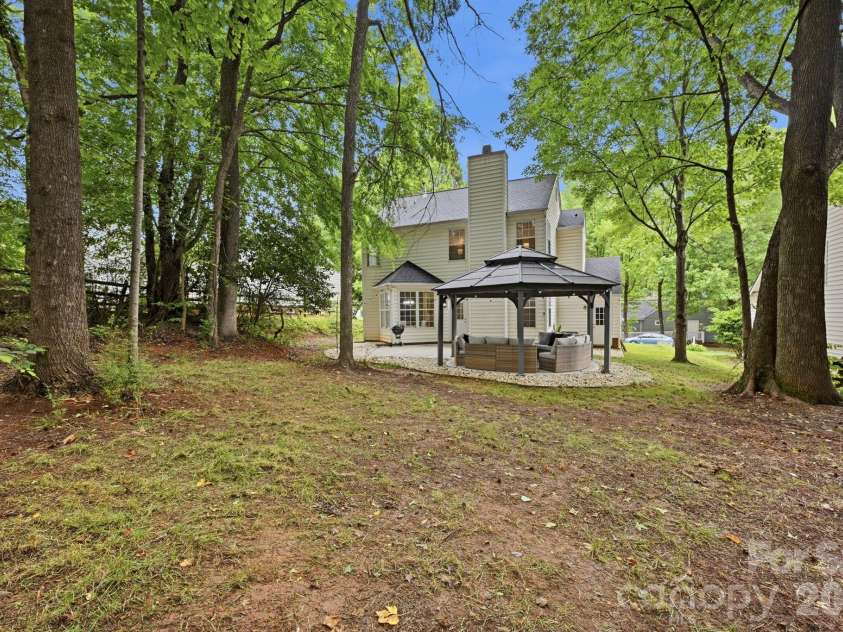 4902 Windchase Lane, Charlotte, NC 28269.  MLS# CAR4389569, YatesRealty ID 28592. Wooded & Private Back Yard