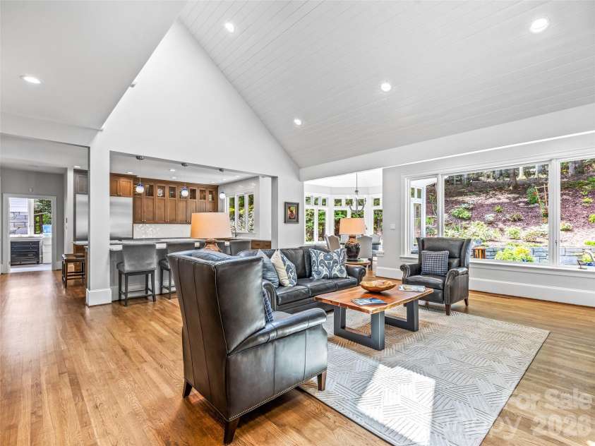 4 Cedar Hill Drive, Asheville, NC 28803.  MLS# CAR4390300, YatesRealty ID 28593. The great room anchored by a spacious custom kitchen