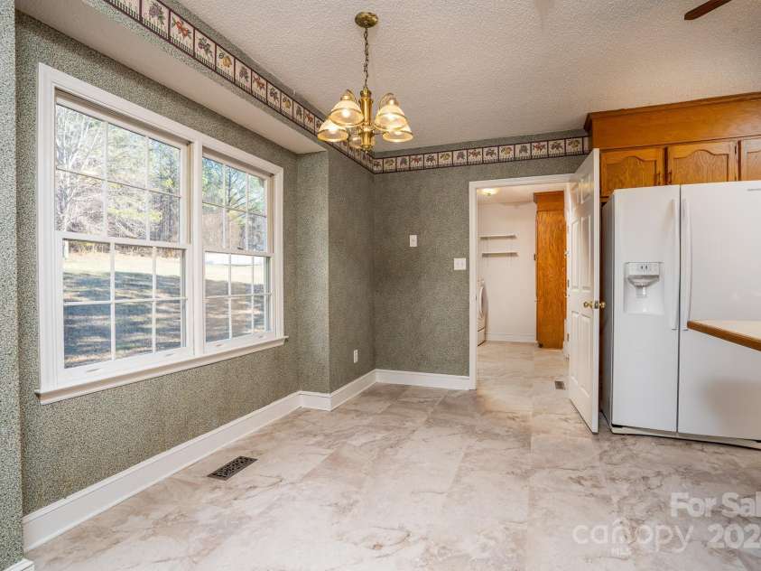 151 Oak Point Drive, Cherryville, NC 28021.  MLS# CAR4135718, YatesRealty ID 2860. Breakfast area overlooking a large private backyard.