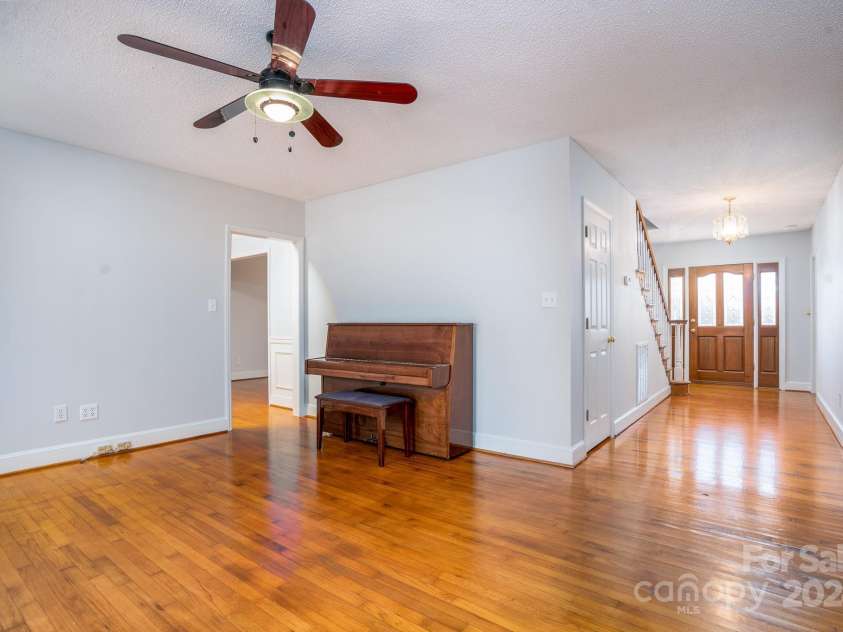 151 Oak Point Drive, Cherryville, NC 28021.  MLS# CAR4135718, YatesRealty ID 2860. If you go straight back from the front door you pass the half bath and come to the family room, office, music room, study, etc.
