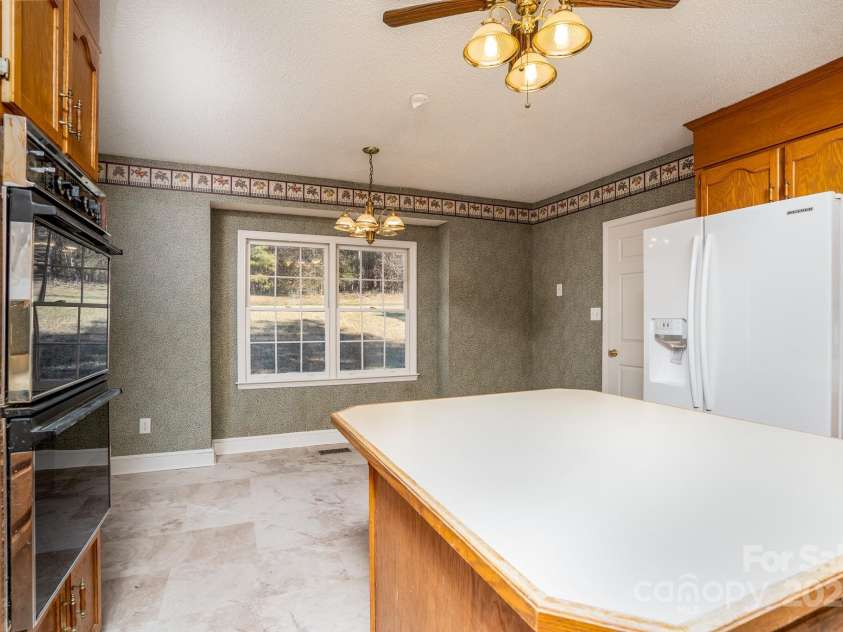 151 Oak Point Drive, Cherryville, NC 28021.  MLS# CAR4135718, YatesRealty ID 2860. Looking from the kitchen towards the breakfast area.
