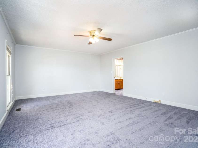 151 Oak Point Drive, Cherryville, NC 28021.  MLS# CAR4135718, YatesRealty ID 2860. Primary Bedroom from entry hall door