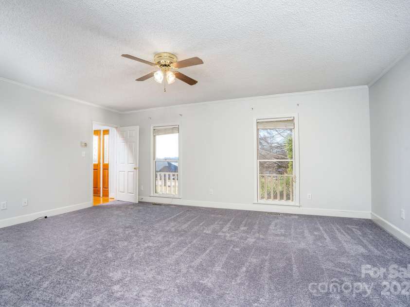 151 Oak Point Drive, Cherryville, NC 28021.  MLS# CAR4135718, YatesRealty ID 2860. Primary bedroom from primary bathroom entrance