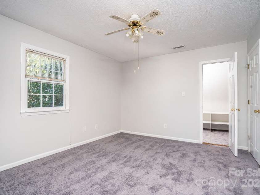 151 Oak Point Drive, Cherryville, NC 28021.  MLS# CAR4135718, YatesRealty ID 2860. The left bedroom upstairs has a hidden feature, check out the private playroom.