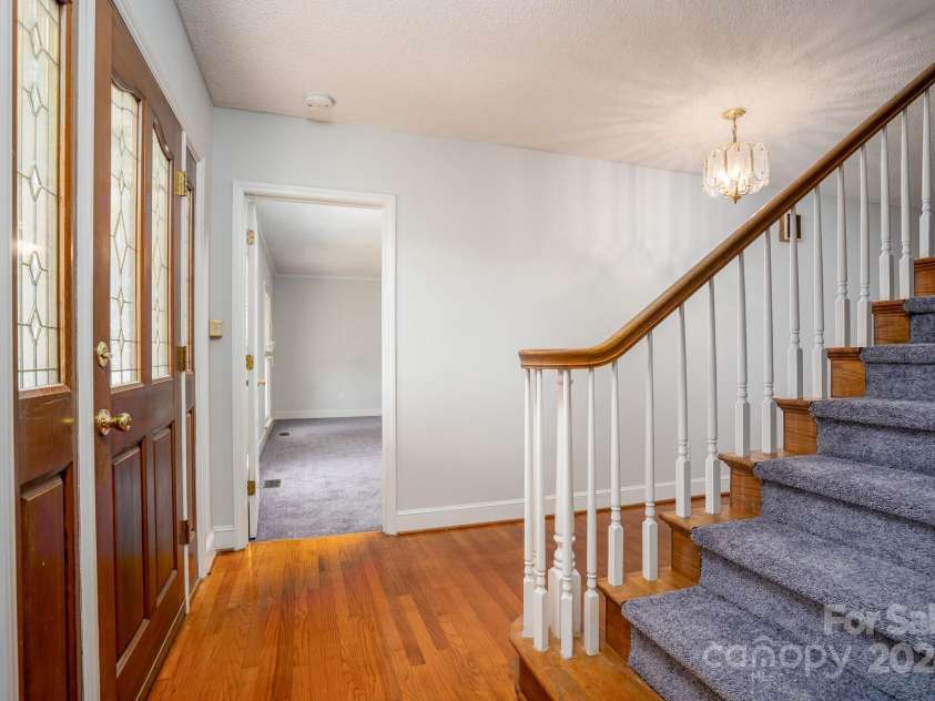 151 Oak Point Drive, Cherryville, NC 28021.  MLS# CAR4135718, YatesRealty ID 2860. To your left as you enter is a very large private main floor primary bedroom and bathroom with large closets.