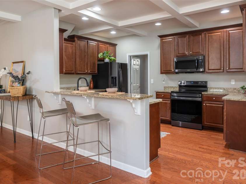 9 Partridge Berry Lane, Weaverville, NC 28787.  MLS# CAR4375602, YatesRealty ID 28605. Enjoy bar seating at the kitchen.