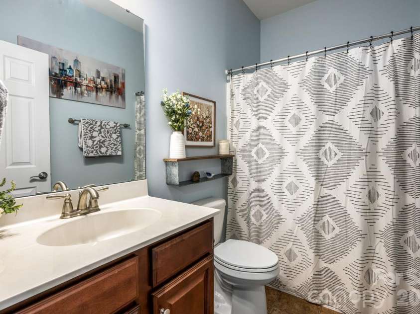 9 Partridge Berry Lane, Weaverville, NC 28787.  MLS# CAR4375602, YatesRealty ID 28605. Main level guest bathroom.