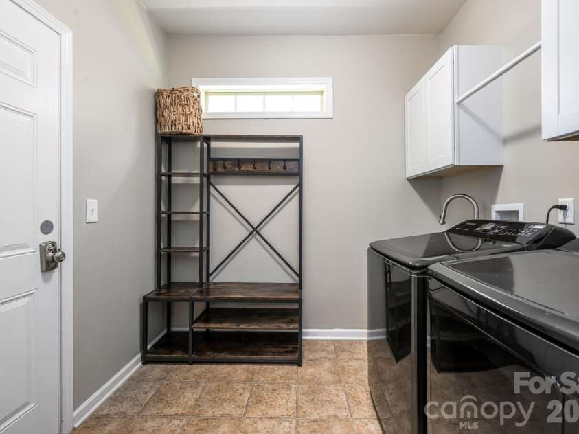 9 Partridge Berry Lane, Weaverville, NC 28787.  MLS# CAR4375602, YatesRealty ID 28605. Mud room/laundry with sink and storage.