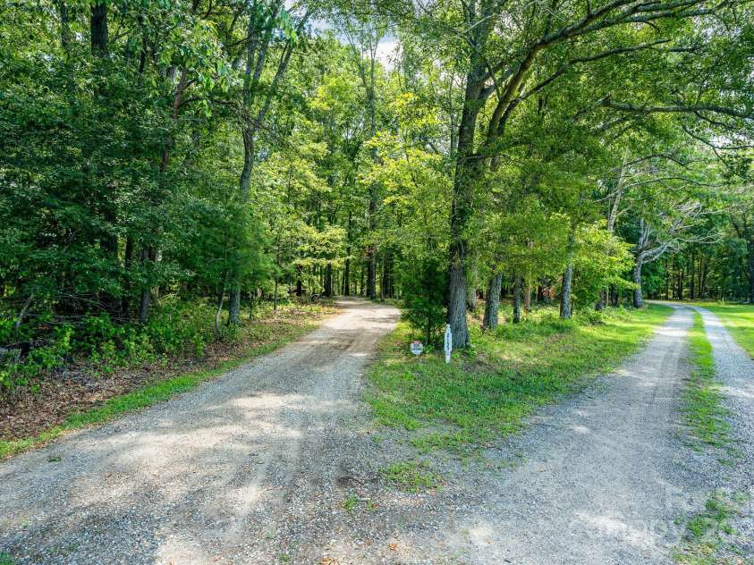 2155 Randolph Road, Shelby, NC 28150.  MLS# CAR4275104, YatesRealty ID 28608. View of driveway from private road off of Randolph Road