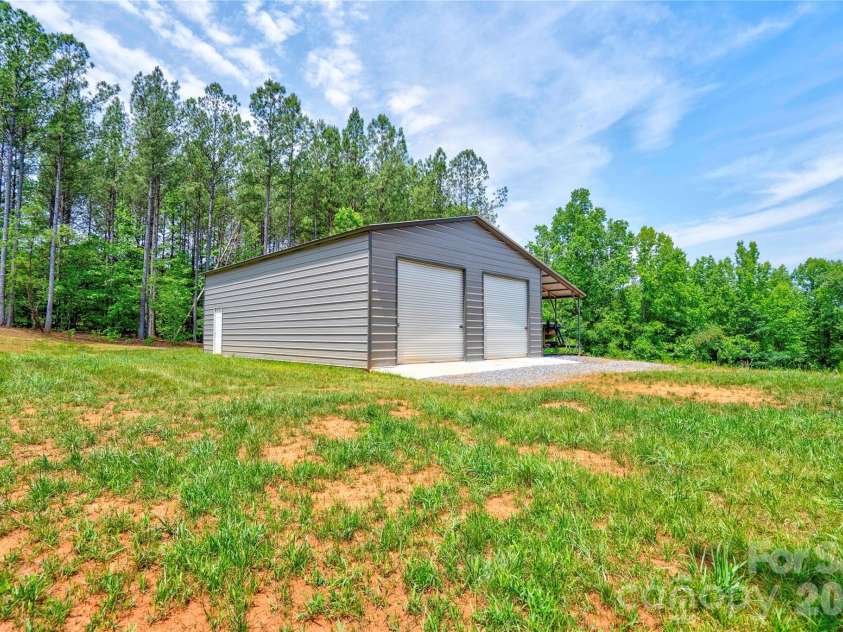 1733 Timber Drive, Mooresboro, NC 28114.  MLS# CAR4387797, YatesRealty ID 28610. Detached Double Garage with Lean To