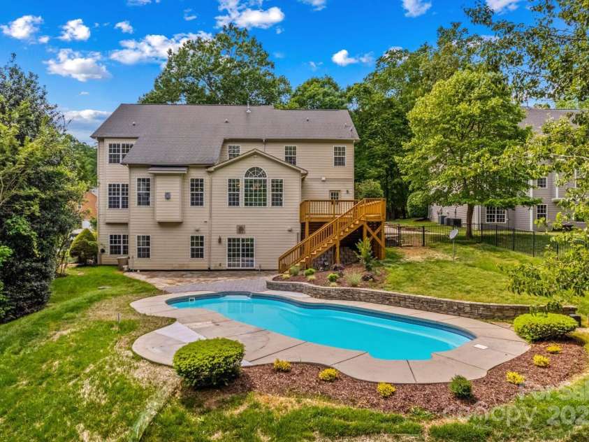 110 Preserve Way, Mooresville, NC 28117.  MLS# CAR4250582, YatesRealty ID 28619. Brand new wood deck overlooks fenced backyard.