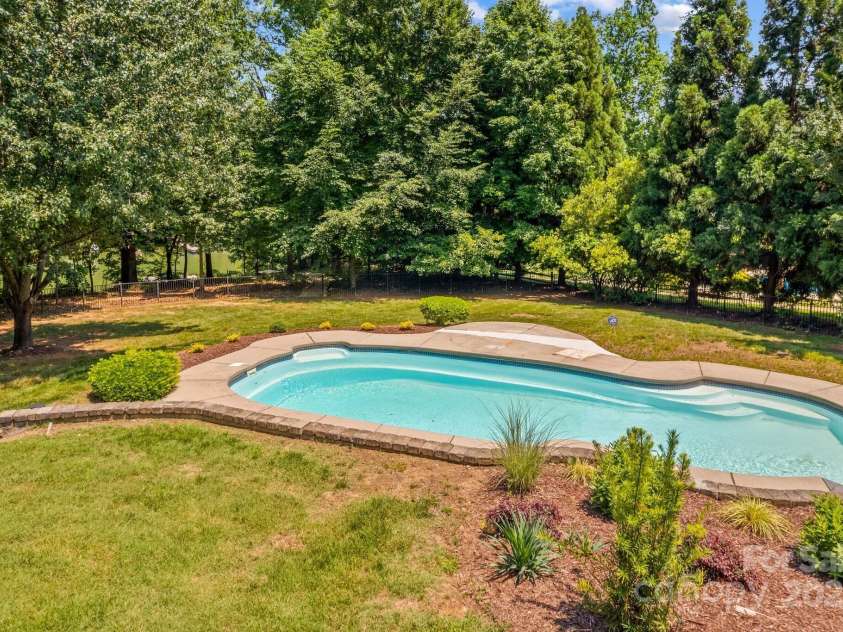 110 Preserve Way, Mooresville, NC 28117.  MLS# CAR4250582, YatesRealty ID 28619. Enjoy swimming in the saltwater pool with a view of the lake.