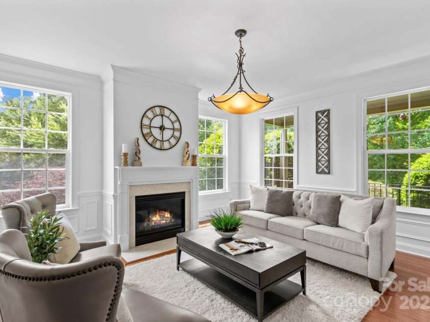 110 Preserve Way, Mooresville, NC 28117.  MLS# CAR4250582, YatesRealty ID 28619. Formal living is centered around a gas fireplace.