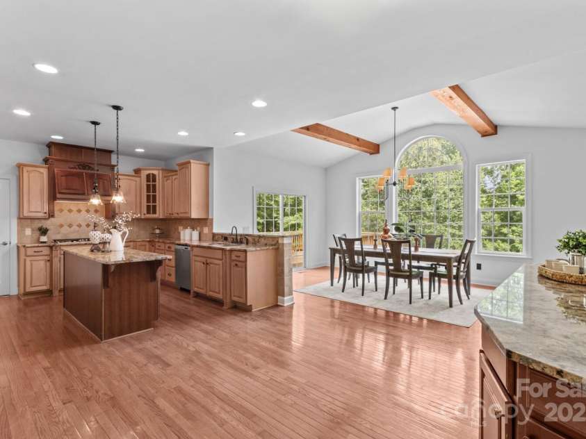 110 Preserve Way, Mooresville, NC 28117.  MLS# CAR4250582, YatesRealty ID 28619. Kitchen features center island, gas cooktop, stainless appliances, granite counters.