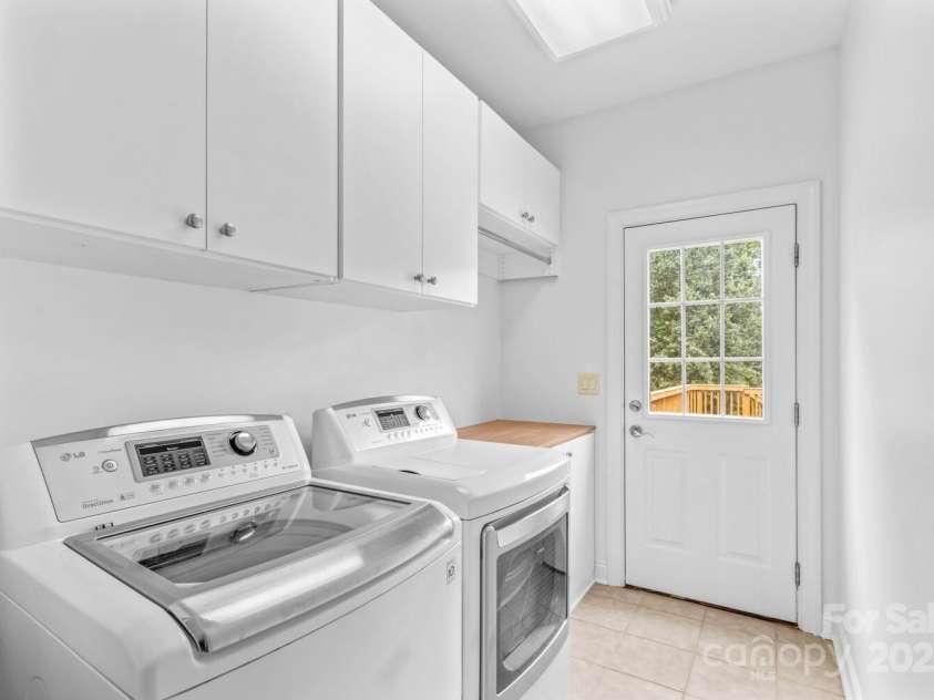 110 Preserve Way, Mooresville, NC 28117.  MLS# CAR4250582, YatesRealty ID 28619. Main level laundry room can act as a mud room coming in from garage and has exterior door to wood deck.