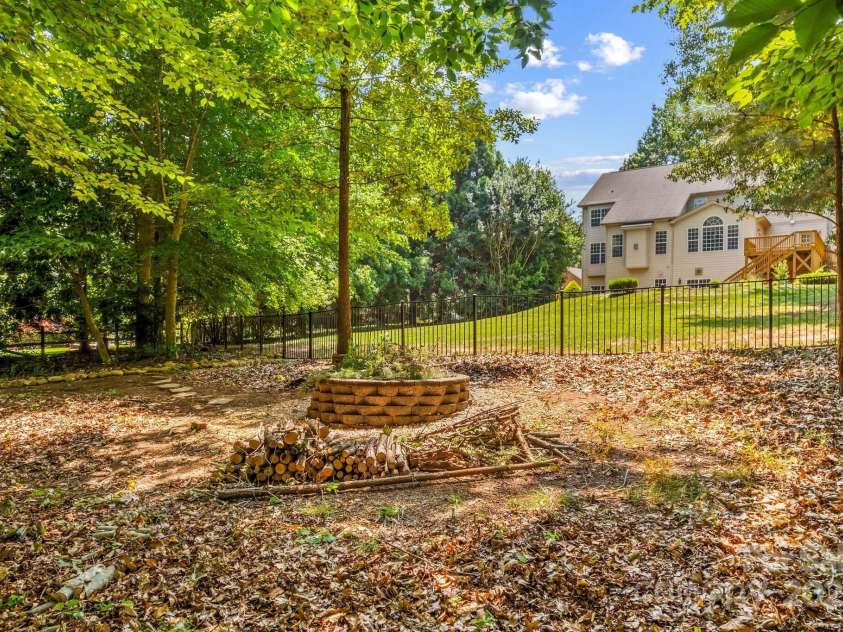 110 Preserve Way, Mooresville, NC 28117.  MLS# CAR4250582, YatesRealty ID 28619. Stone firepit is perfect for enjoying the cool Carolina nights.