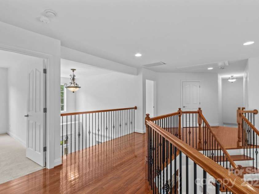 110 Preserve Way, Mooresville, NC 28117.  MLS# CAR4250582, YatesRealty ID 28619. Wood floors throughout upstairs hallway. New carpet in every bedroom.